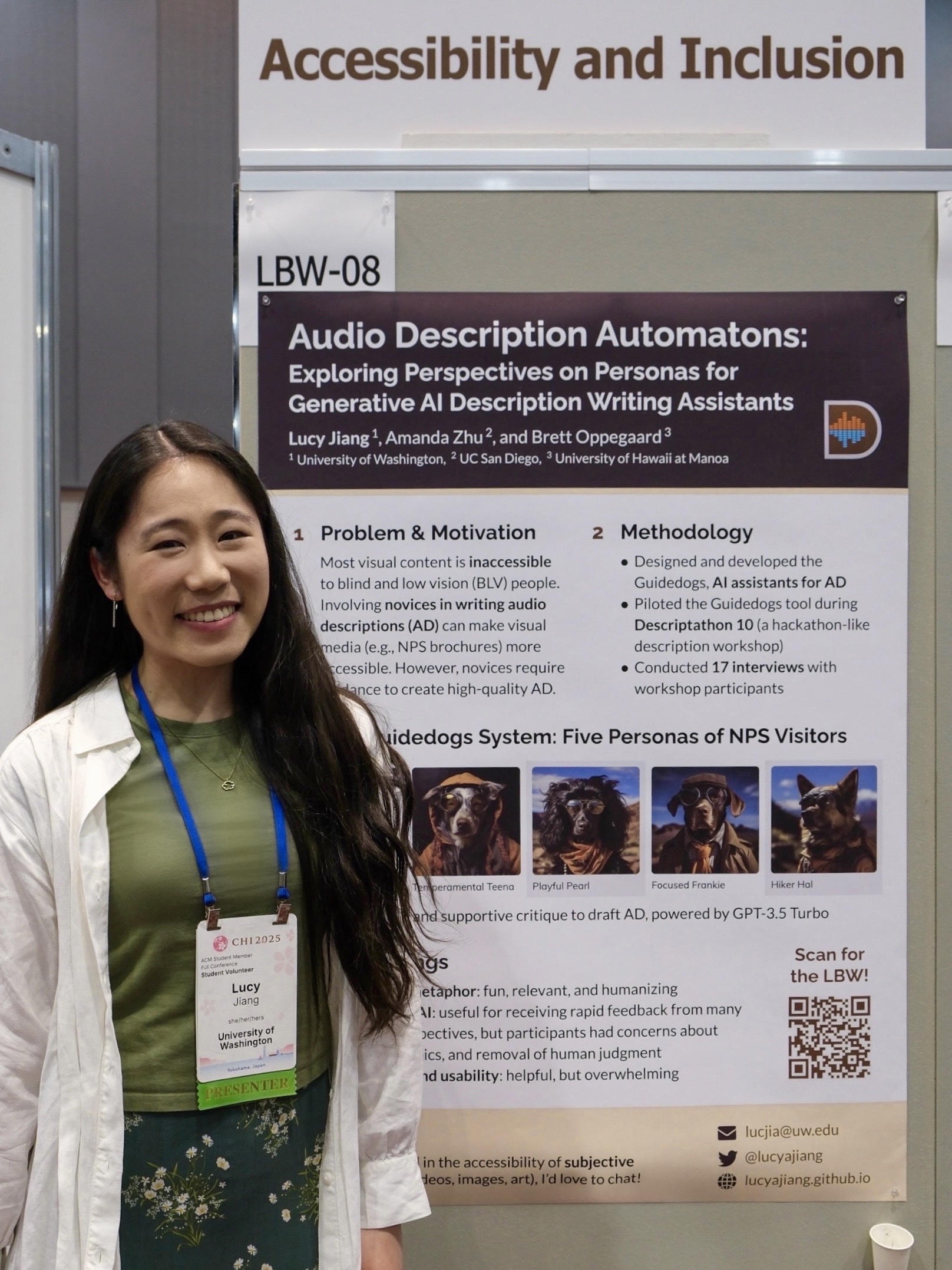 Lucy stands to the left of her CHI poster, titled 'Audio Description Automatons: Exploring Perspectives on Personas for Generative AI Description Writing Assistants.' She is smiling and wearing a light green shirt, a white linen overshirt, a dark green floral skirt, and her CHI attendee badge. Above the poster are two signs reading 'Accessibility and Inclusion' and 'LBW-08.'