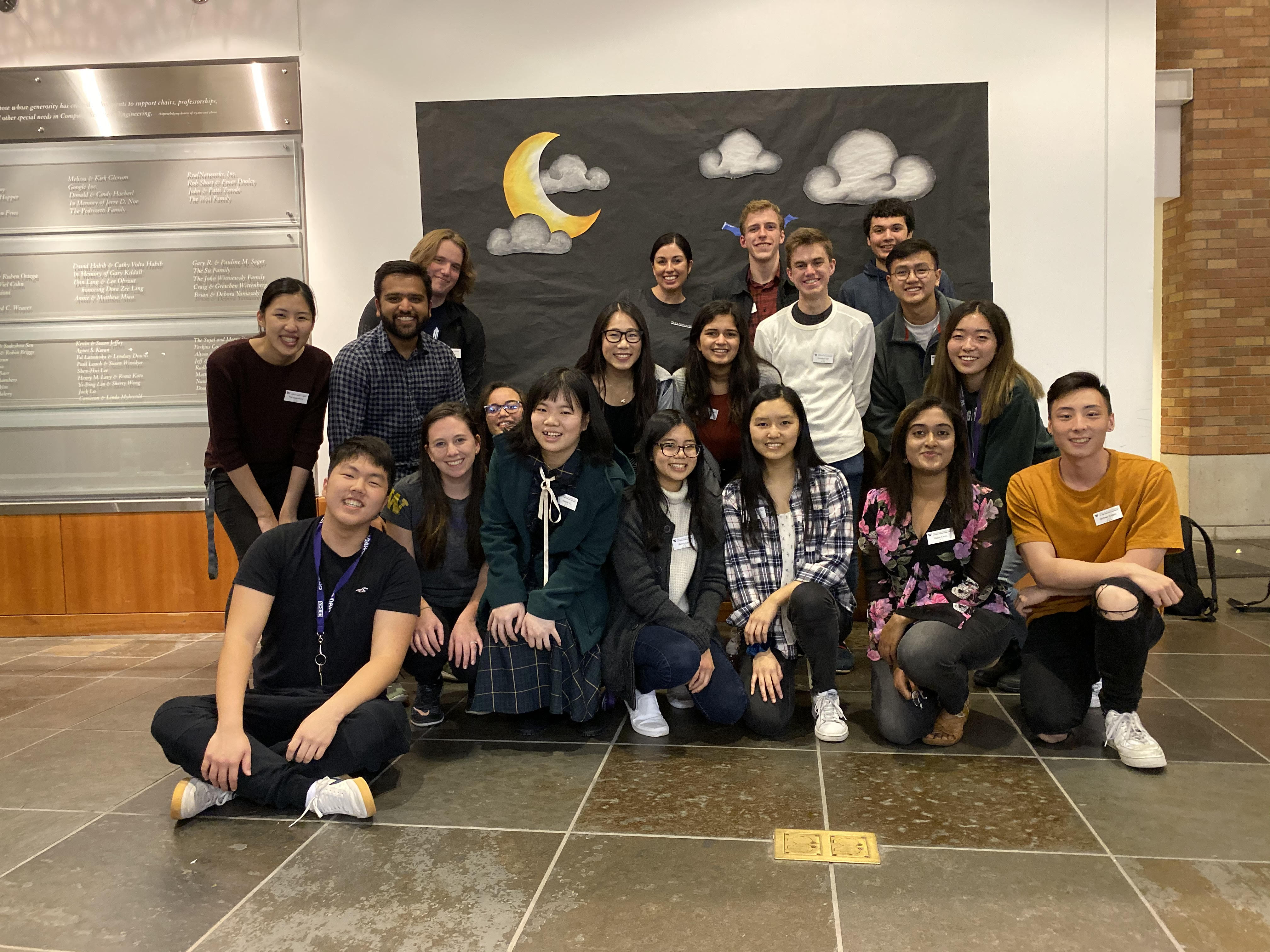 Group photo of ACM officers (2019) in front of a Halloween-themed black photo backdrop.